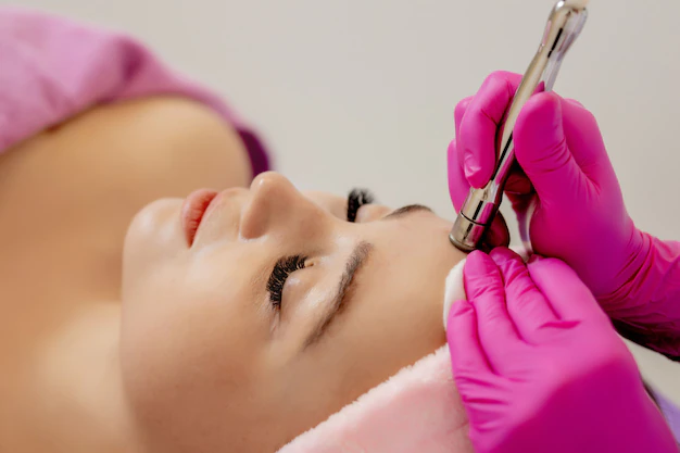 hardware cosmetology cosmetologist doing procedure ultrasonic cleaning face young woman getting ultrasonic peeling beauty salon cosmetological clinic healthcare clinic cosmetology 130265 4338