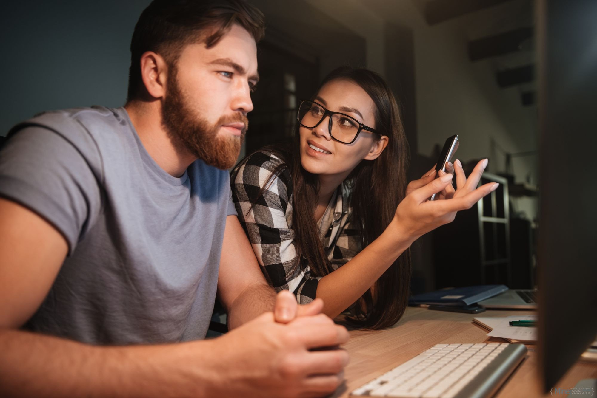 two business colleagues working late at night in their office with computer woman talk sbi 302894182